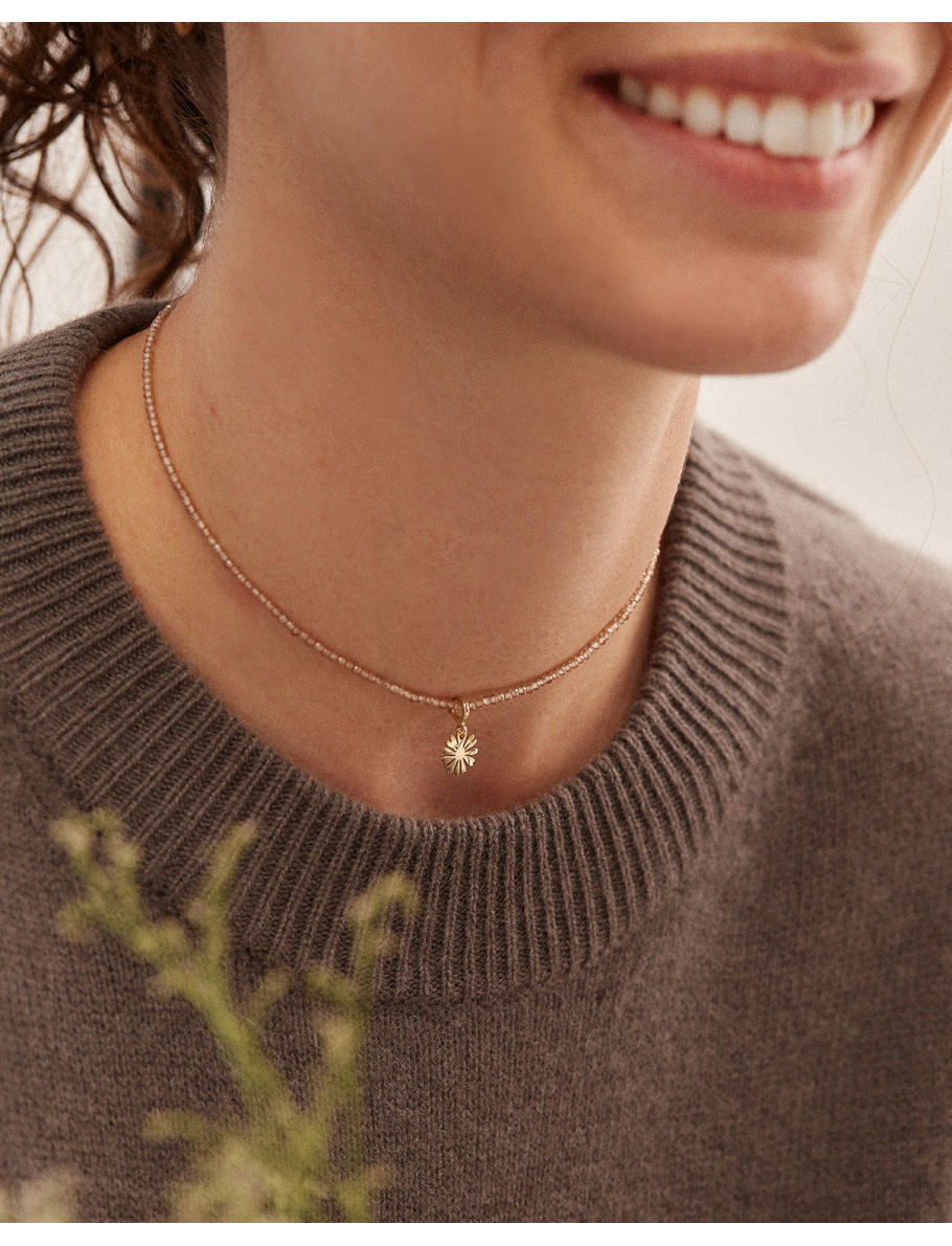 Gold choker with charm